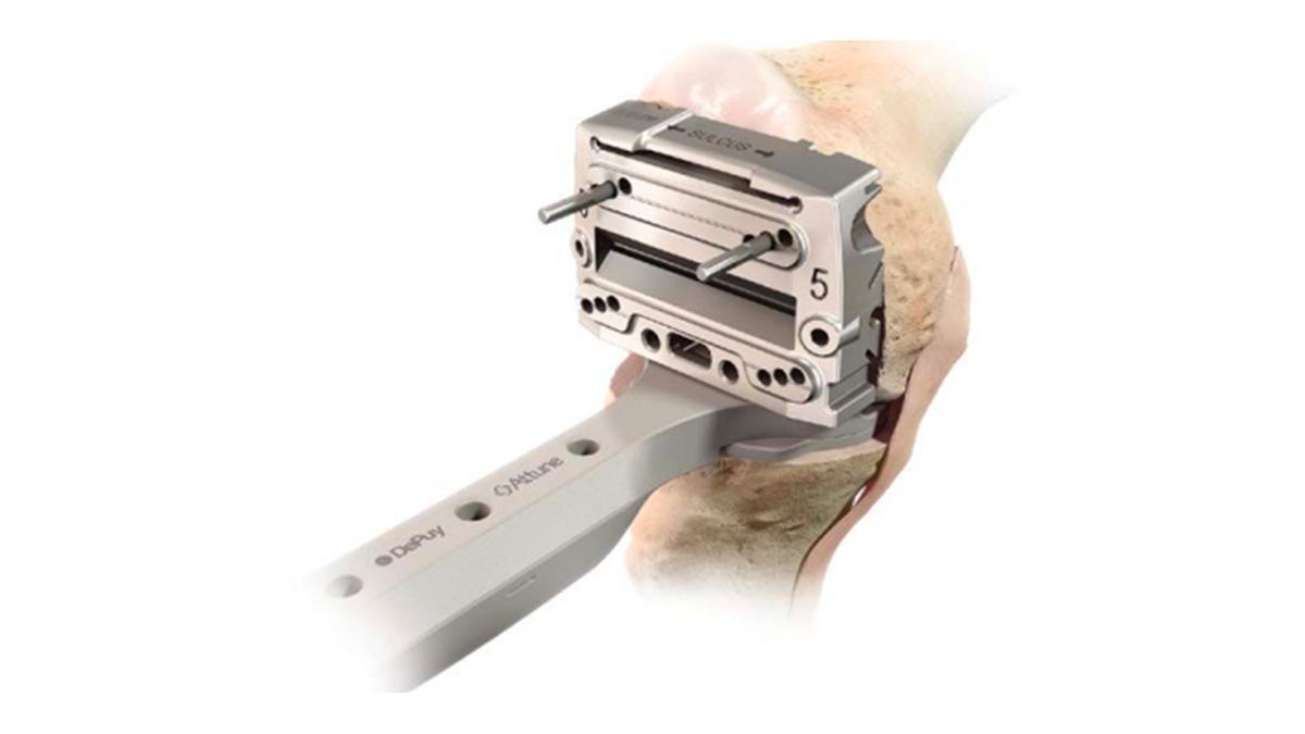 knee flexion space being checked with spacer block