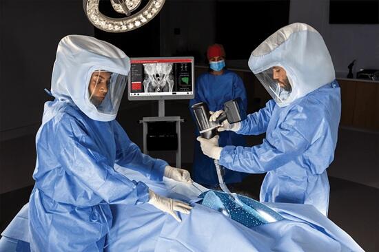 Two surgeons working on a patient